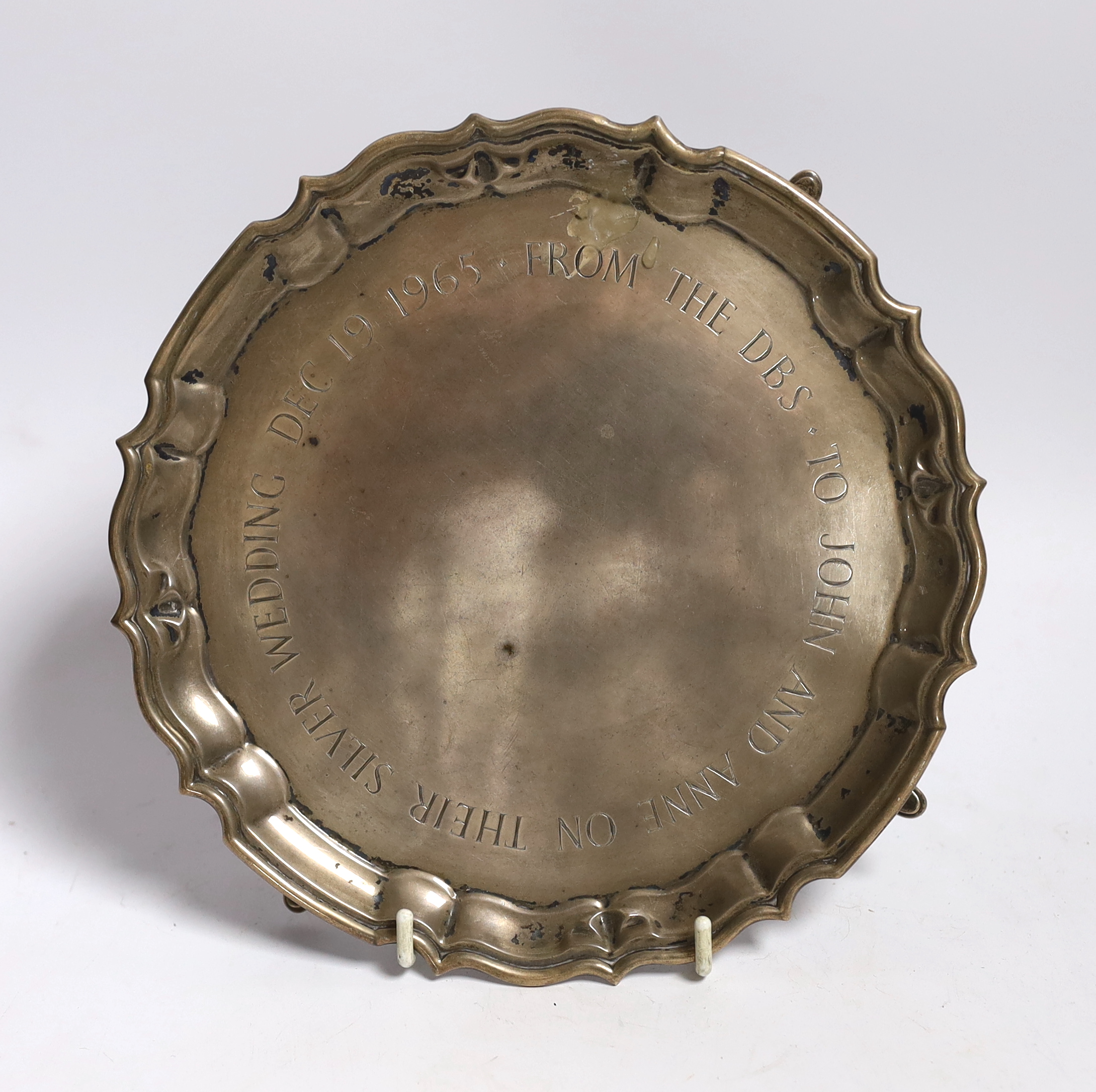 A small George V presentation silver waiter with later central script ‘To John and Ann on their silver wedding Dec 1965 from the DBS’ London, 1919 by Carrington & Co, 20.9cm, 10.7oz.